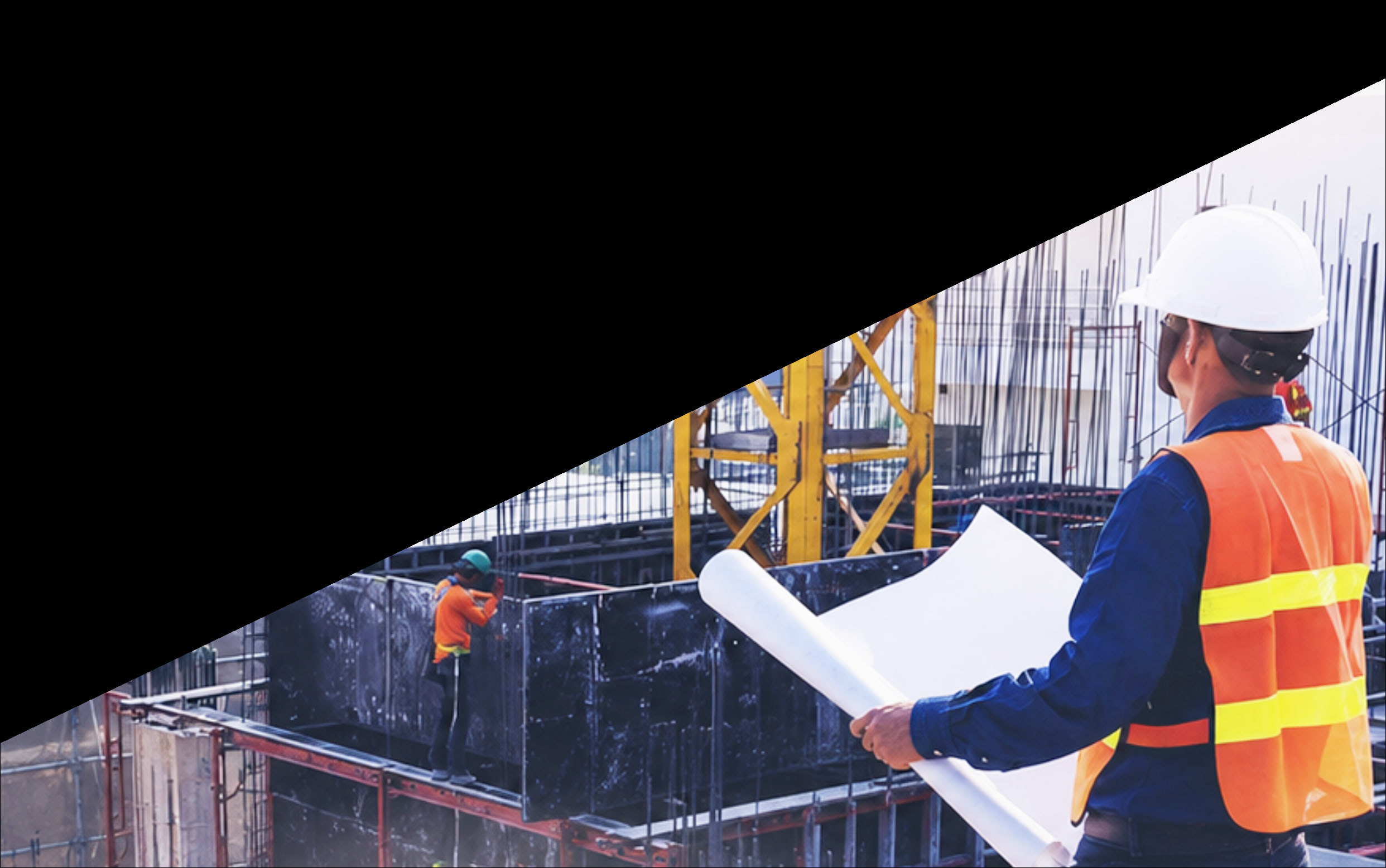 Kuasa Sekata site supervisor reviewing construction plans